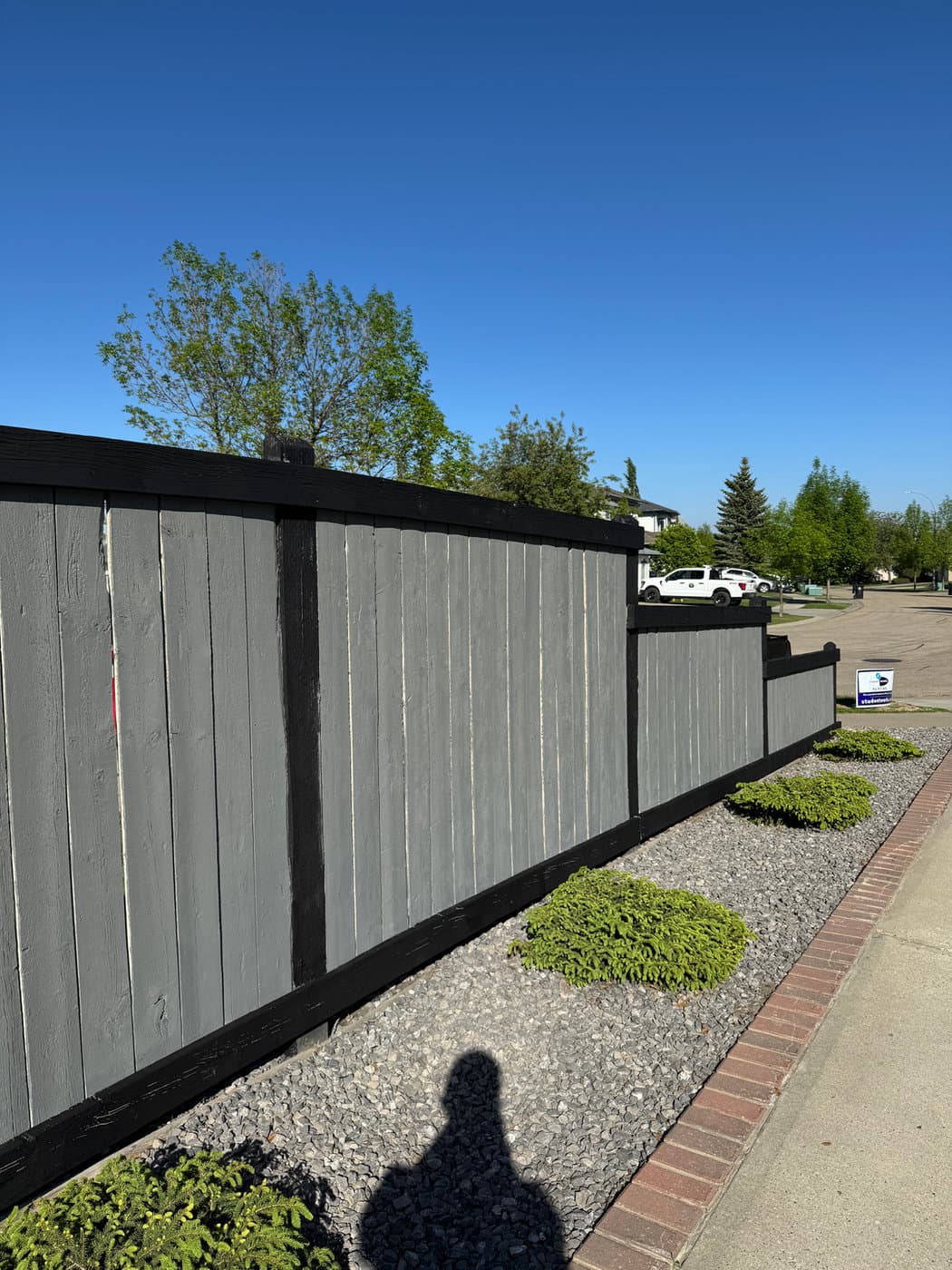 Solid-stain fence finish. Pressure-washed, sanded, primed where needed, and two-coat sealed for Alberta freeze-thaw cycles.